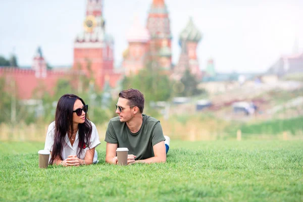 Young dating couple in love walking in city background St Basils Church — Stock Photo, Image