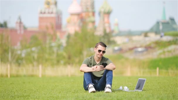 Happy young urban man in european city outdoors — Stock Video