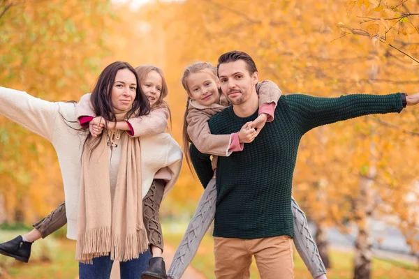 Portrait of happy family of four in autumn day — Stock Photo, Image