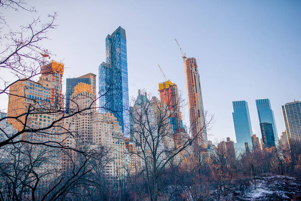 Central Park in winter with skyscrapers background, New York City, USA