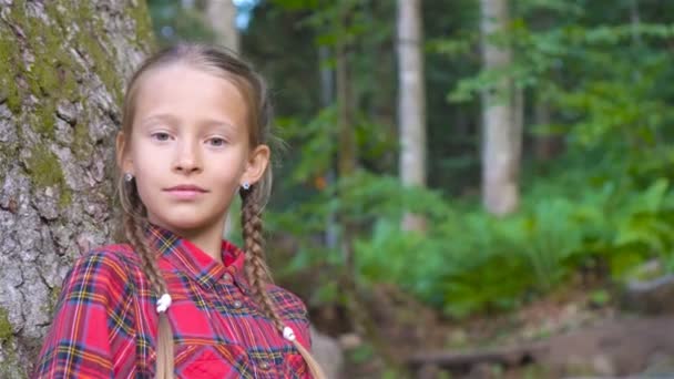 Beautiful happy little girl in mountains in the background of fog — Stock Video