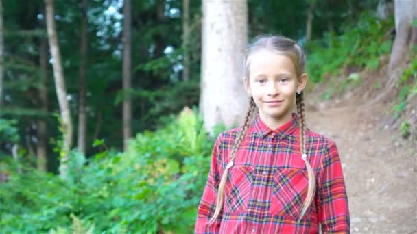 Beautiful happy little girl in mountains in the background of fog — Stock Video