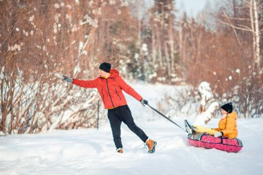 Family of dad and kid vacation on Christmas eve outdoors