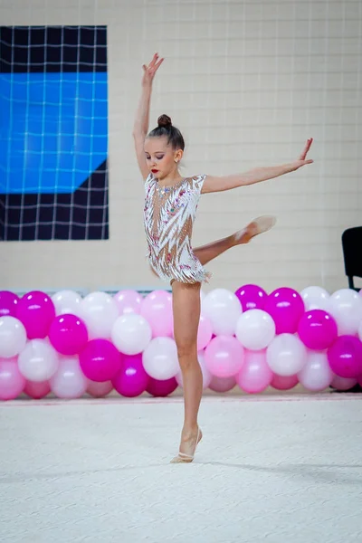 Little gymnast training on the carpet and ready for competitions