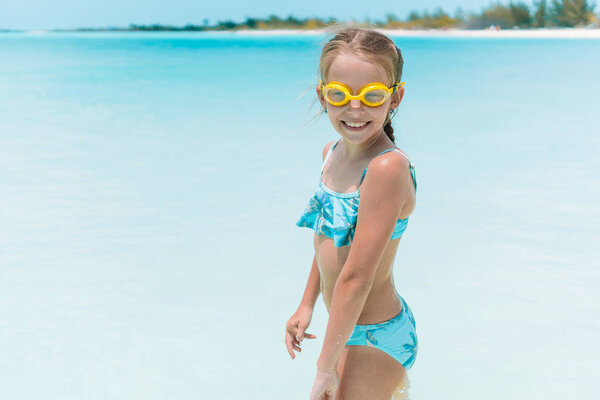 Cute little girl at beach during summer vacation