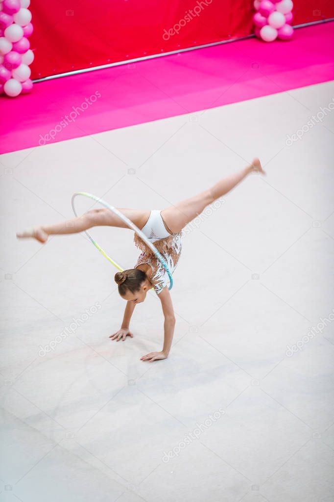 Little gymnast training on the carpet and ready for competitions