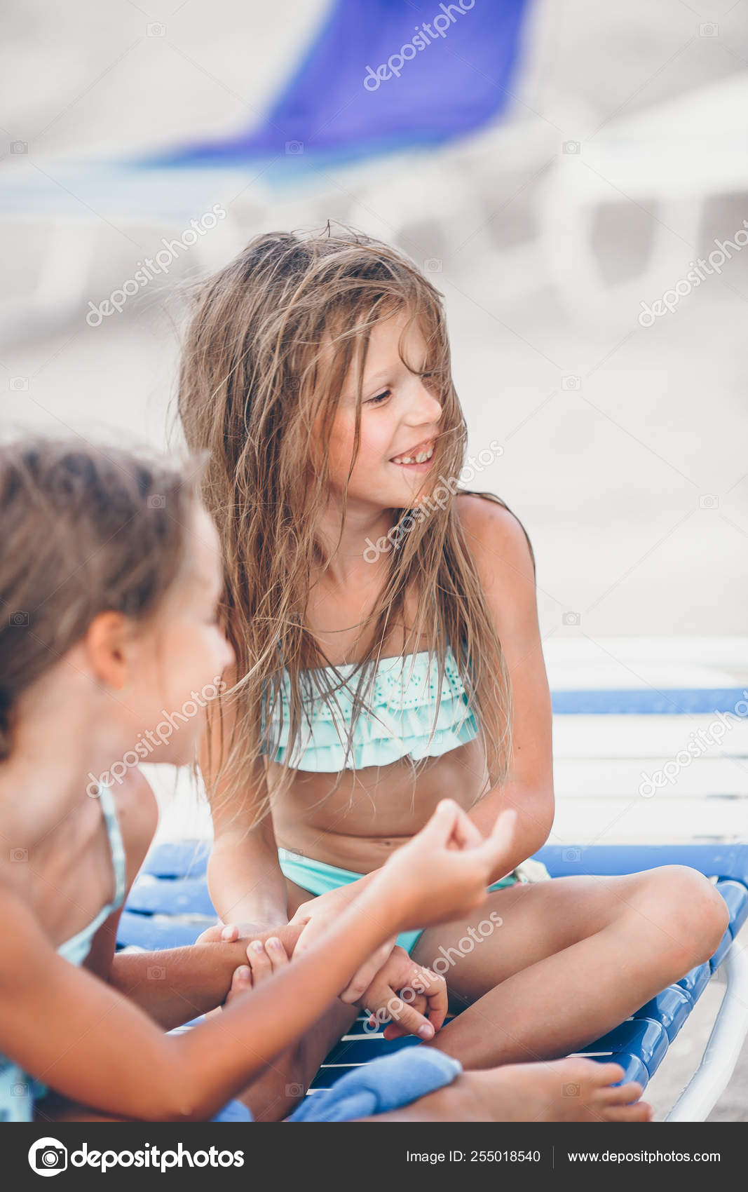 Little girls having fun at tropical beach playing together Stock Photo by  ©d.travnikov 255018540