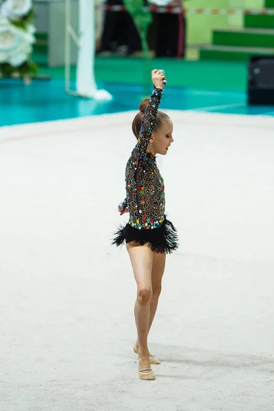 Little gymnast training on the carpet and ready for competitions