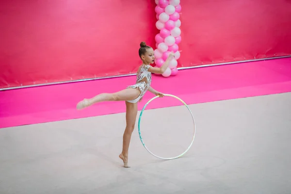 Little gymnast training on the carpet and ready for competitions