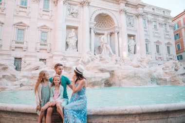 Family near Fontana di Trevi, Roma, Italy.