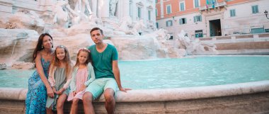 Family near Fontana di Trevi, Roma, Italy.