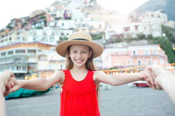 Adorable little girl on warm and sunny summer day in Positano town in Italy — Stock Photo, Image