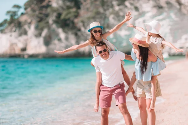 Happy beautiful family with kids on the beach — Stock Photo, Image