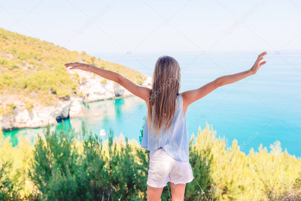 Little girl on vacation travel background beautiful landscape