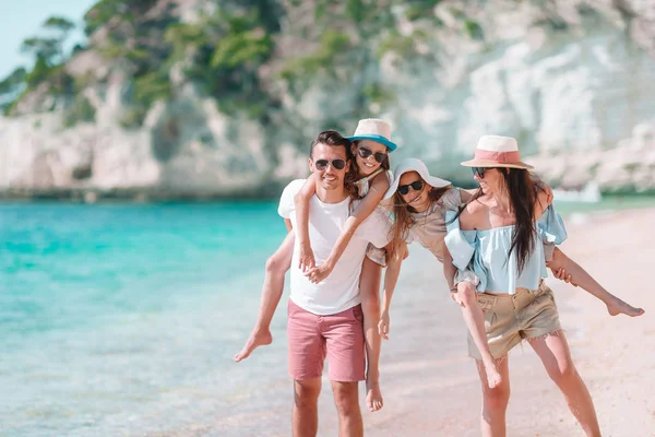 Happy beautiful family with kids on the beach — Stock Photo, Image