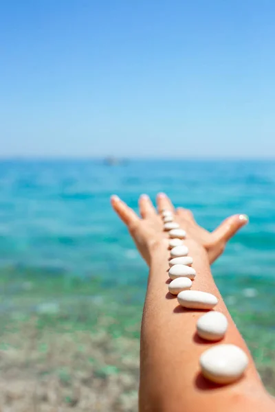 Handful of sea stones on the beach. Conceptual design — Stock Photo, Image