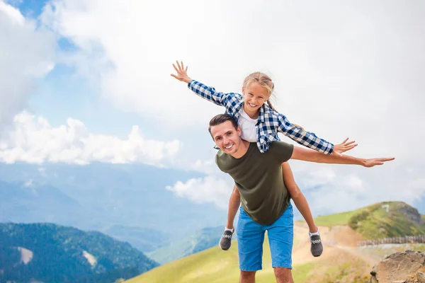 Beautiful happy family in mountains in the background of fog — Stock Photo, Image