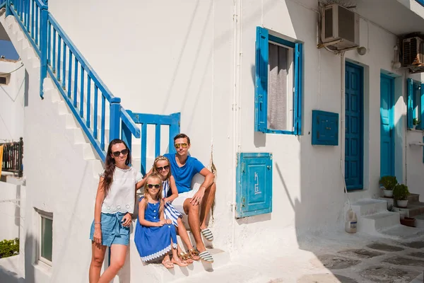 Parents and kids at street of typical greek traditional village on Mykonos Island, in Greece — Stock Photo, Image