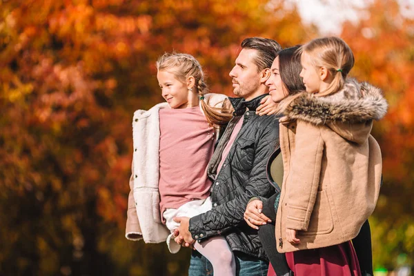 Portrait of happy family of four in autumn day — Stock Photo, Image