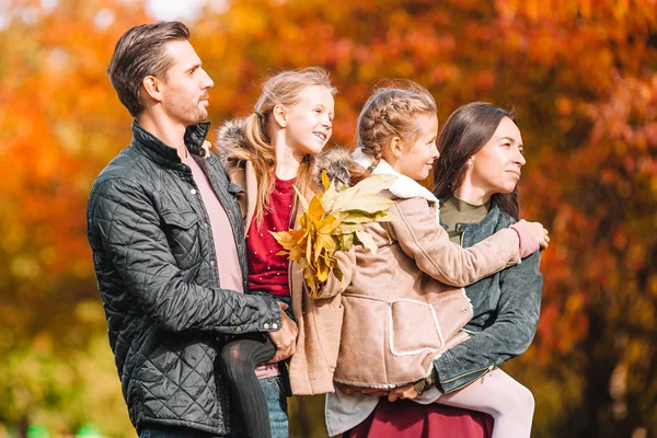 Portrait of happy family of four in autumn day — Stock Photo, Image