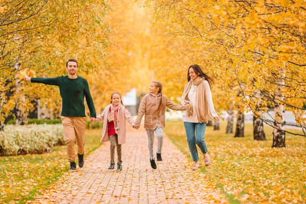 Portrait of happy family of four in autumn day — Stock Photo, Image