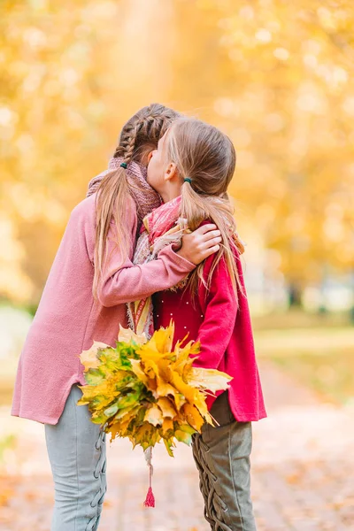 Little adorable girls outdoors at warm sunny autumn day — Stock Photo, Image