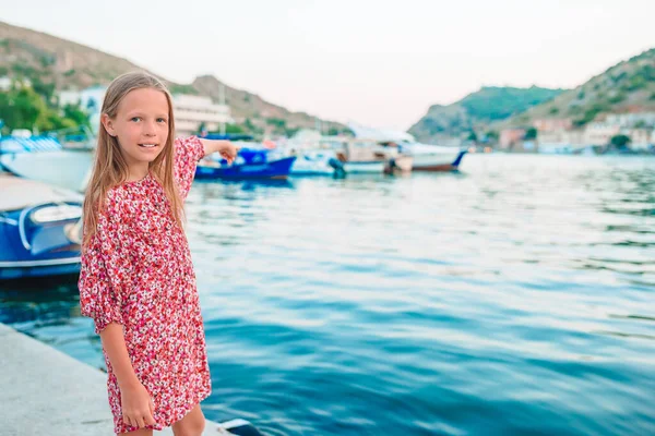 Adorable little girl in port at summer day — Stock Photo, Image