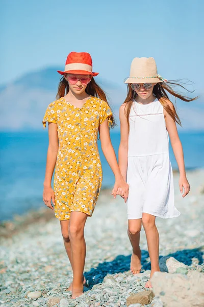 Adorable little girls having fun on the beach — Stock Photo, Image