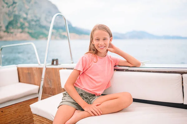 Little girl sailing on boat in clear open sea — Stock Photo, Image