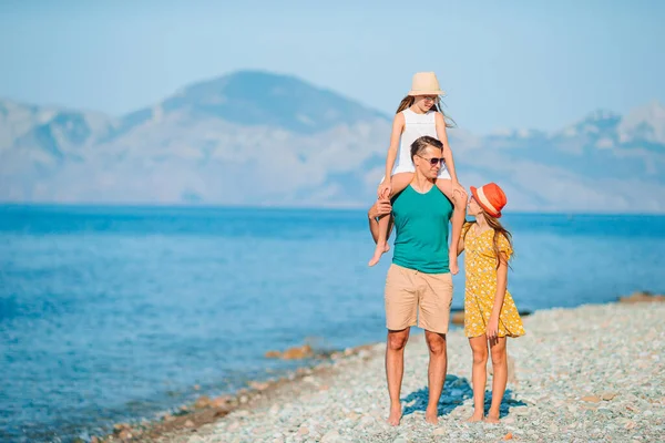 Happy beautiful family on a tropical beach vacation — Stock Photo, Image