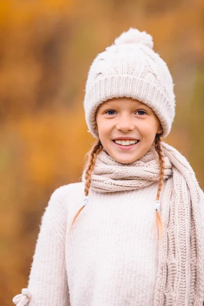 Adorable little girl at beautiful autumn day outdoors — Stock Photo, Image