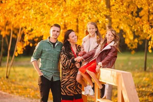 Portrait of happy family of four in autumn day — Stock Photo, Image
