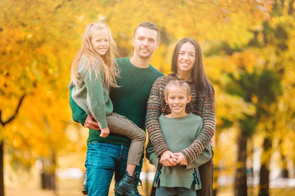 Portrait of happy family of four in autumn day — Stock Photo, Image