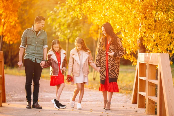 Portrait of happy family of four in autumn — Stock Photo, Image