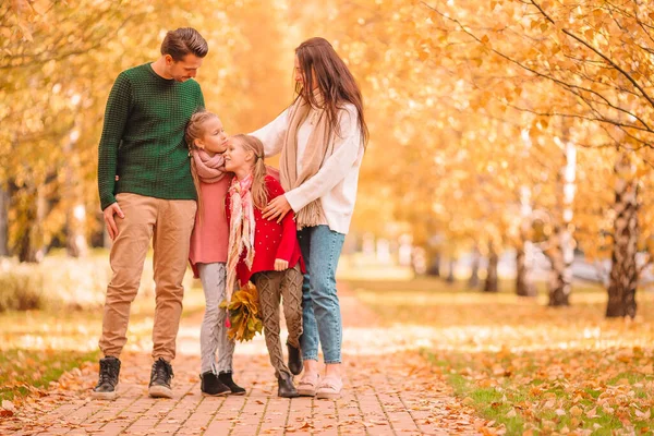 Portrait of happy family of four in autumn day — Stock Photo, Image