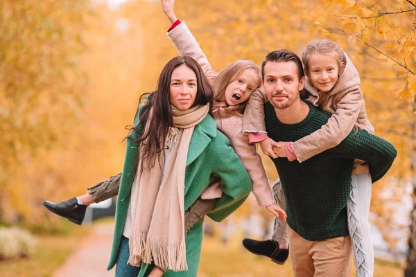 Portrait of happy family of four in autumn — Stock Photo, Image