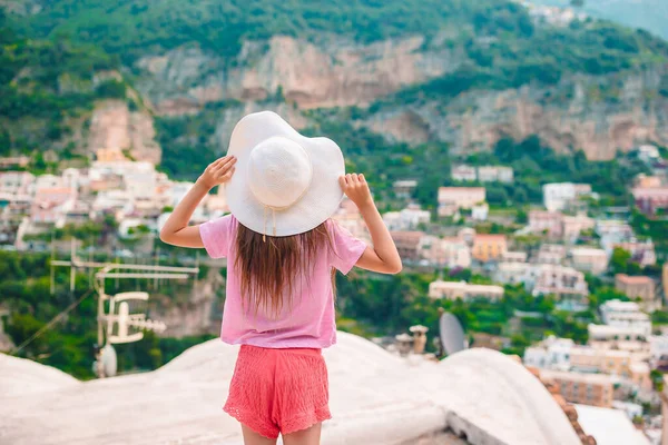 Adorable little girl on warm and sunny summer day in Positano town in Italy — Stock Photo, Image