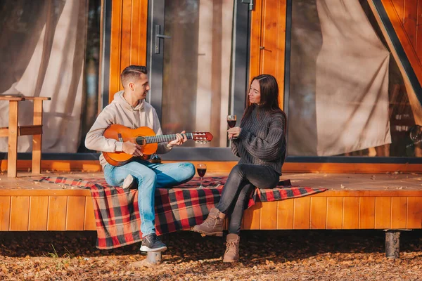 Happy family of two on the terrace in autumn — Stock Photo, Image