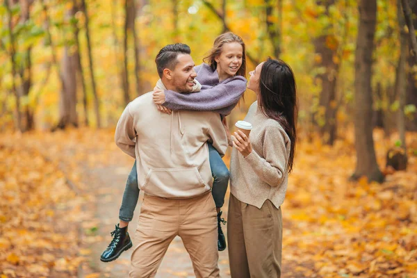 Portrait of happy family of three in autumn day — Stock Photo, Image