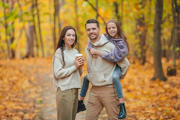 Portrait of happy family of three in autumn day — Stock Photo, Image