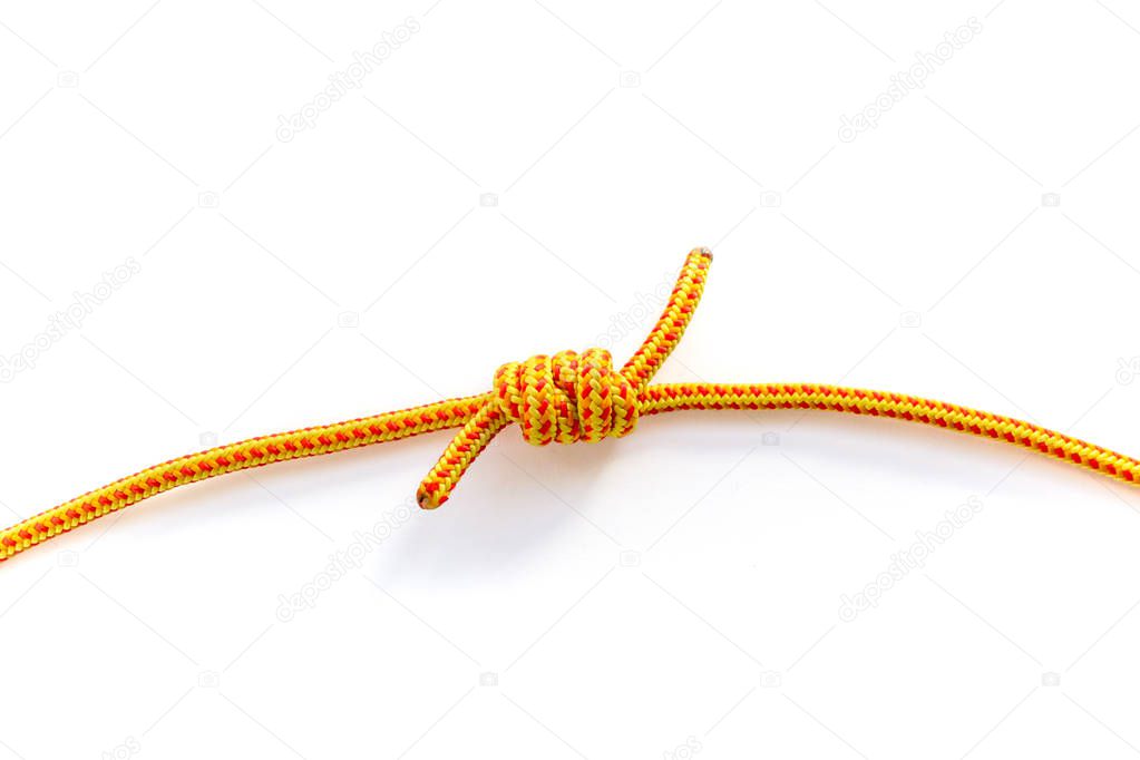 Close up of grapevine knot joining two rope strands. Macro of a double fisherman's bend done with 5mm yellow climbing rope.