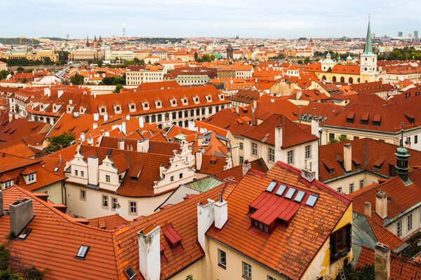 Aerial shot of roofs of houses in Prague, Czech Republic, during a city break in Autumn. Popular European travel destination.