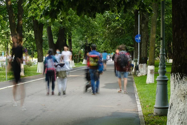 Unrecognizable people on a busy sidewalk in Bucharest, Romania, after Coronavirus (Covid-19) restrictions were lifted.