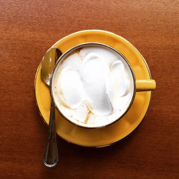 milk coffee with ice cream on top in a chocolate cup