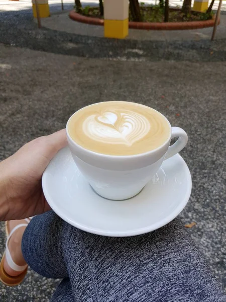 cappuccino with heart shape in a cup with motion blur