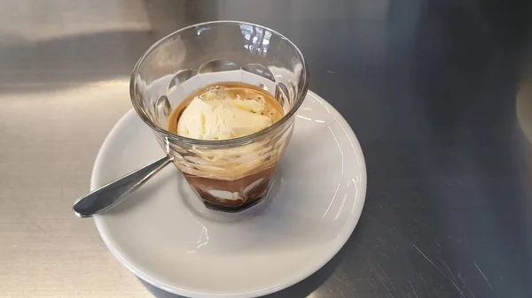 cappuccino with ice cream in a glass on the table