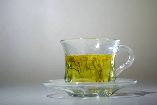 light background glass tea pair, chamomile tea