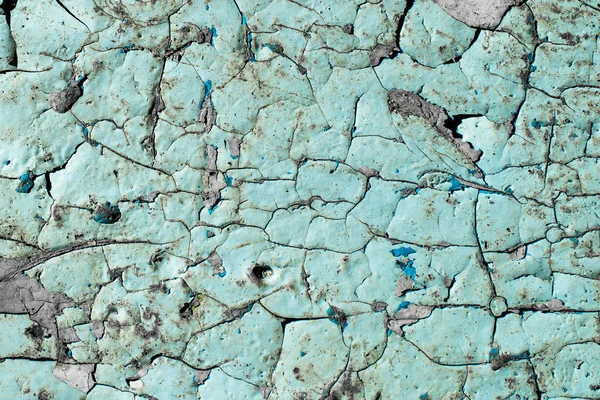ahşap bir yüzey üzerinde eski mavi boya, tahta üzerinde çatlak boya