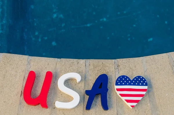 Patriotic USA background with decorations near the swimming pool