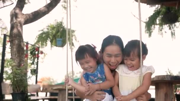 Portrait Two Pretty Little Girls Her Mother Playing Wooden Swings — Stock Video